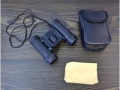 Folded pocket binoculars with a 10x25 case SM-631